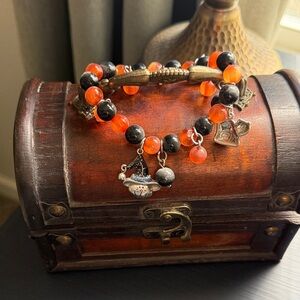 Elegant Black and Orange Beaded Bracelet with Charms